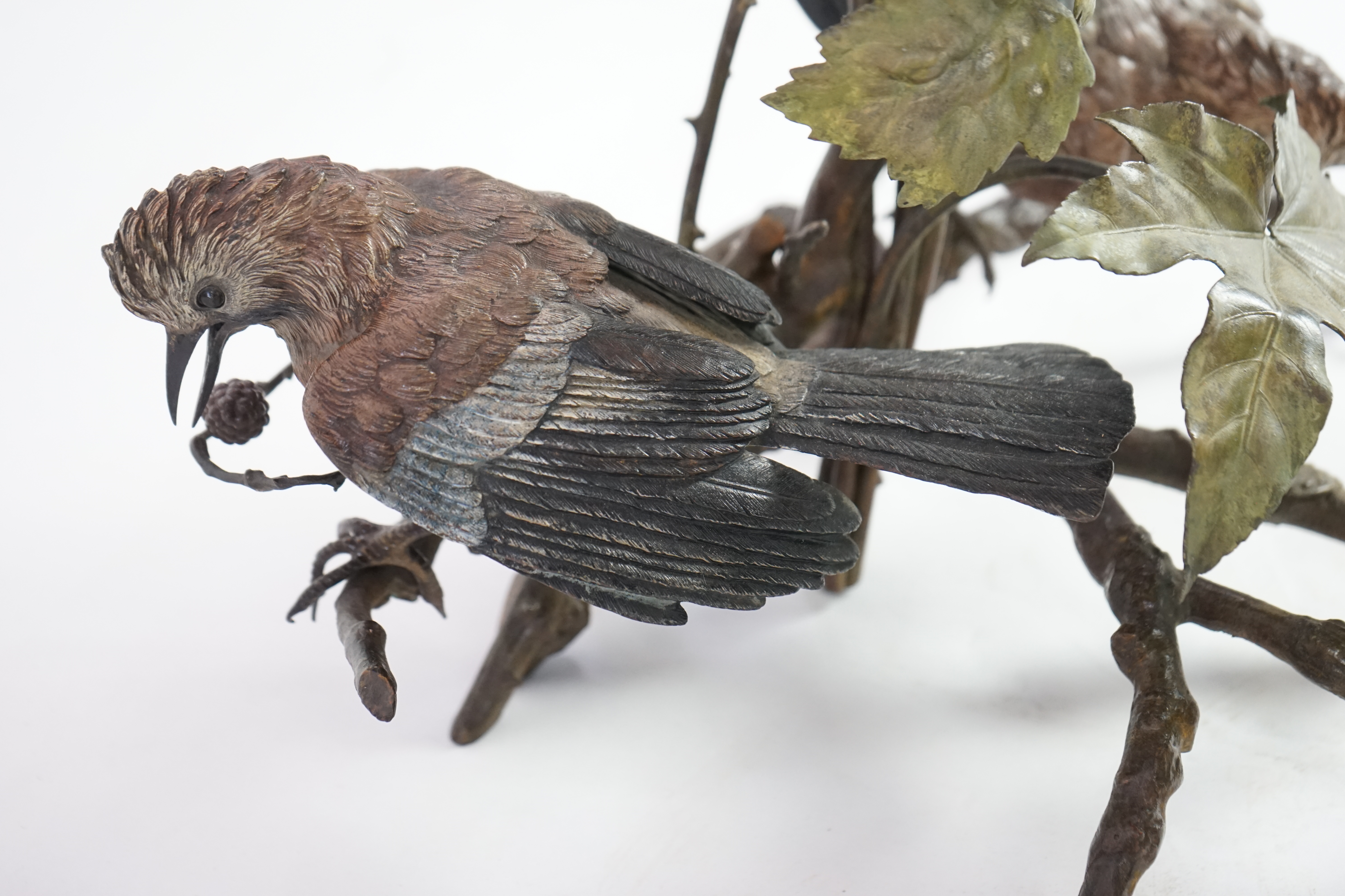 An impressive late 19th century Austrian cold painted bronze group of three jays perched amongst branches